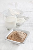 Ingredients for a yogurt drink with kama (finely milled flour mixture, Estonia)