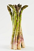 A bunch of green asparagus against a white background