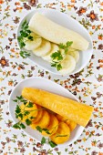 White and yellow carrots; slices and a piece
