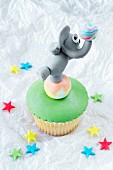 A cupcake decorated with an elephant
