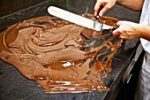 A confectioner tempering chocolate