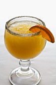 An orange Margarita with a sugared rim
