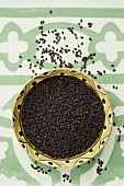 A bowl of black sesame seeds