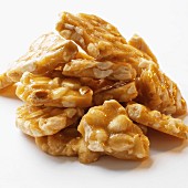 A pile of peanut brittle