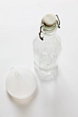 A glass bottle and a funnel