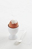 A hard-boiled egg in an egg cup