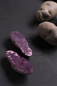 Purple potatoes, whole and halved