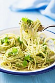 Spaghetti al pesto (spaghetti with green pesto, Italy)