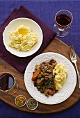 Beef stroganoff with mashed potatoes and red wine
