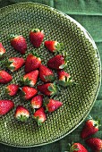 Strawberries on a green ceramic dish