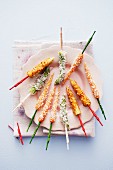 Coconut carrots, asparagus tips with Parmesan and crispy corn cobs with chilli
