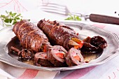 Goose roulade stuffed with peppers, gherkins and mushrooms
