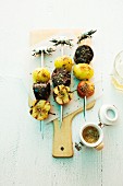 Grilled black pudding skewers with potatoes and apples