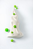 Meringue decorated with green sugar pearls (Christmas)