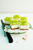 Slices of sour cream cake with green apple jelly
