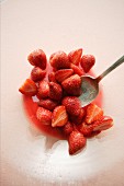Sugared strawberries with a spoon