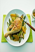 Braised chicken with asparagus and oranges
