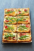 Mini tomato tarts with asparagus and rocket