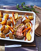 Loin rack joint of lamb with a herb crust and roasted vegetables