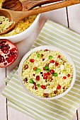 Couscous with raisins, almonds and pomegranate seeds