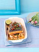Baked salmon with prawns, chilli peppers and spring onions