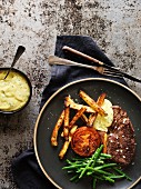 Steak with Bearnaise sauce, beans, grilled tomato and French fries