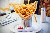 French fries in a paper bag, ketchup and mayonnaise