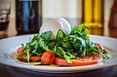 Tomato salad with mozzarella and rocket