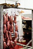 Fresh Italian sausages hanging in a butchers