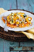 Grain salad with oranges, peppers and courgettes