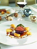 Beef fillet with a herb crust on a bed of red cabbage