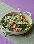 Asparagus risotto with chicken, peas and ham