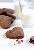 Heart-shaped chocolate biscuits and glasses of milk for Valentine's Day