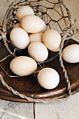 Organic eggs in a wire basket