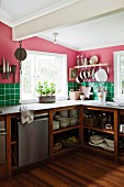 Simple kitchen in cheerful colours with open-fronted crockery shelves in base units