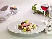 Duck breast on a bed of rice with chestnuts and Brussels sprouts