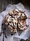 Pavlova with nuts and chocolate, sliced