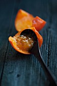 Cold-stirred persimmon jam with a spoon