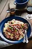 Coq au vin with pappardelle and broad beans