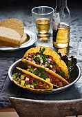 Tacos with chilli con carne, onions and avocade (Mexico)