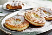 Ausgezogene (Bavarian-style doughnuts) dusted with icing sugar