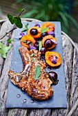 A veal chop with grilled fruit