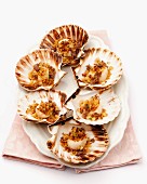 Fried scallops served in their shells