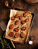 Oven-roasted tomatoes on a baking tray