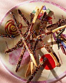 Chocolate sticks decorated with coloured sprinkles