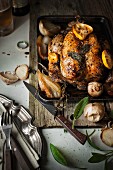 Roast chicken with sage, lemons, onions and garlic