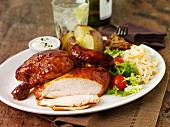 Chicken with a baked potato and salad