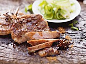 Caramelised pork cheeks on a cucumber and ginger salad