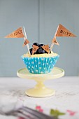 A lemon and blueberry cupcake for a baby shower