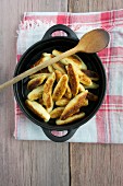 Potato orzo pasta in a cast iron pan